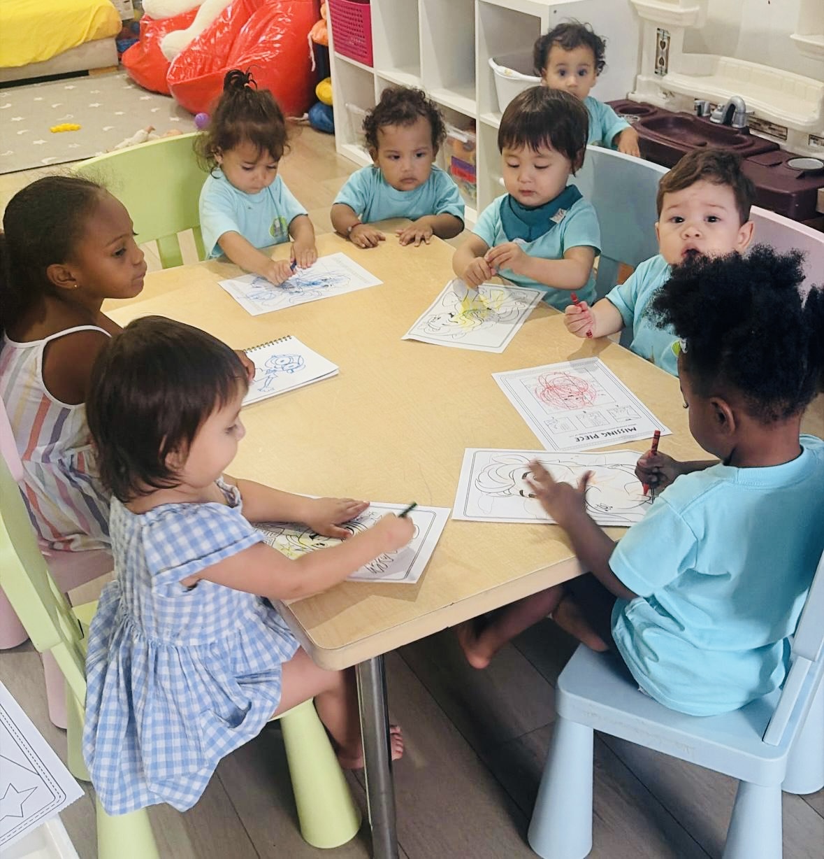Children doing a classroom learning activity at a table